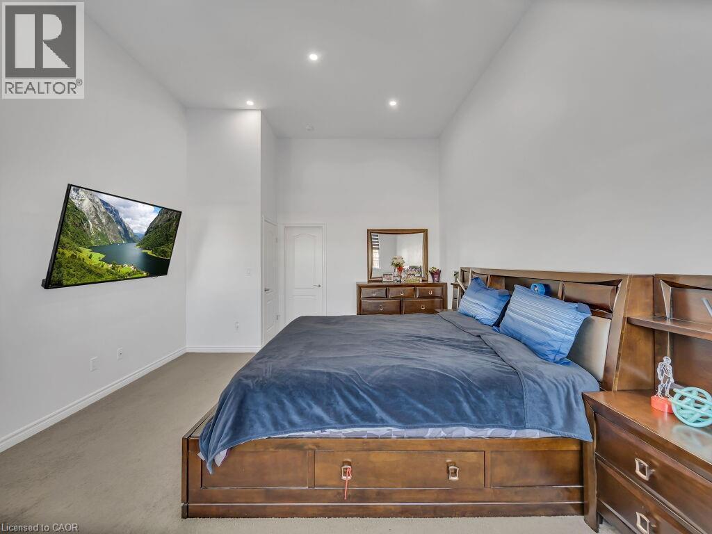 Bedroom featuring a towering ceiling, carpet, and recessed lighting - 144 Summit Ridge Drive, Guelph, ON - Indoor Photo Showing Bedroom