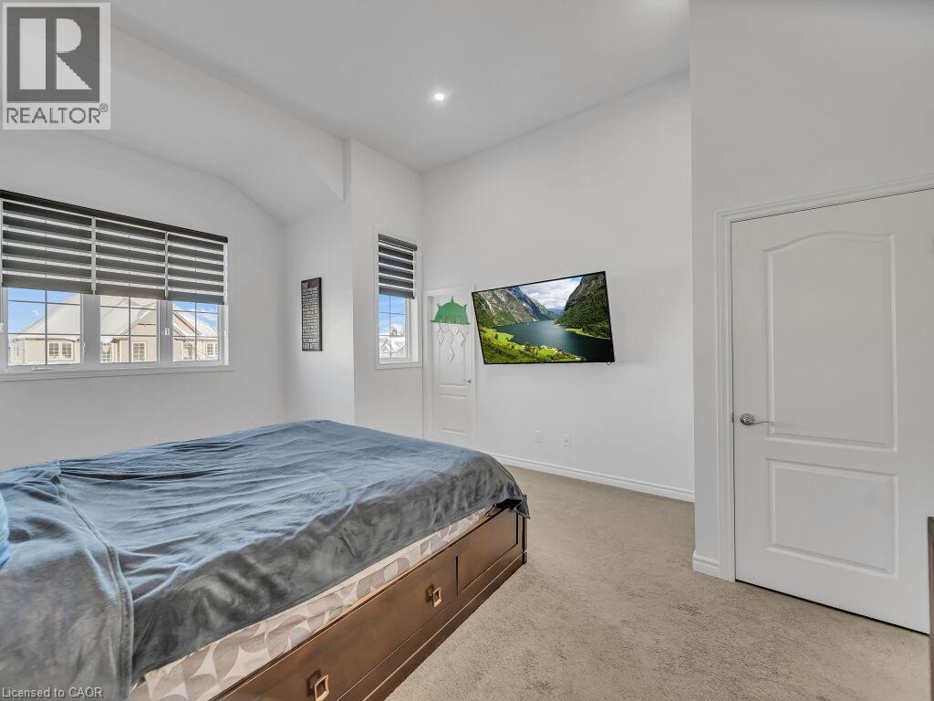 Bedroom featuring light colored carpet and recessed lighting - 144 Summit Ridge Drive, Guelph, ON - Indoor Photo Showing Bedroom