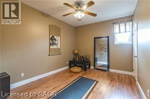 Exercise room featuring light wood-type flooring and ceiling fan - 158 River Run Road, Drayton, ON - Indoor Photo Showing Other Room