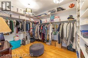 Walk in closet featuring light wood-style flooring - 158 River Run Road, Drayton, ON - Indoor With Storage
