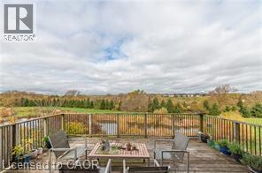 Wooden terrace featuring an outdoor hangout area - 158 River Run Road, Drayton, ON - Outdoor With Deck Patio Veranda With View