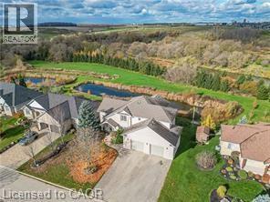 Aerial perspective of suburban area featuring a nearby body of water - 158 River Run Road, Drayton, ON - Outdoor With View