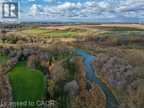 Aerial view of property and surrounding area with a large body of water and rural landscape - 158 River Run Road, Drayton, ON - Outdoor With View