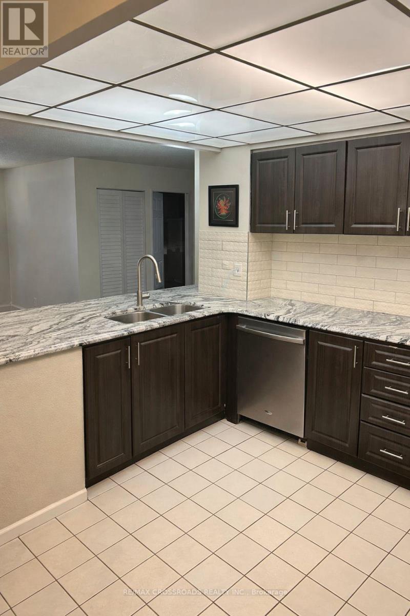 209 - 8 Silverbelle Grove, Toronto, ON - Indoor Photo Showing Kitchen With Double Sink