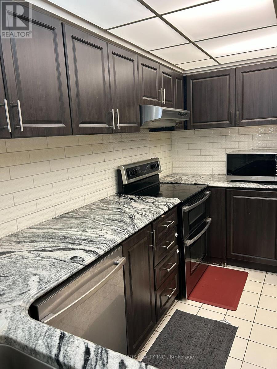 209 - 8 Silverbelle Grove, Toronto, ON - Indoor Photo Showing Kitchen With Upgraded Kitchen