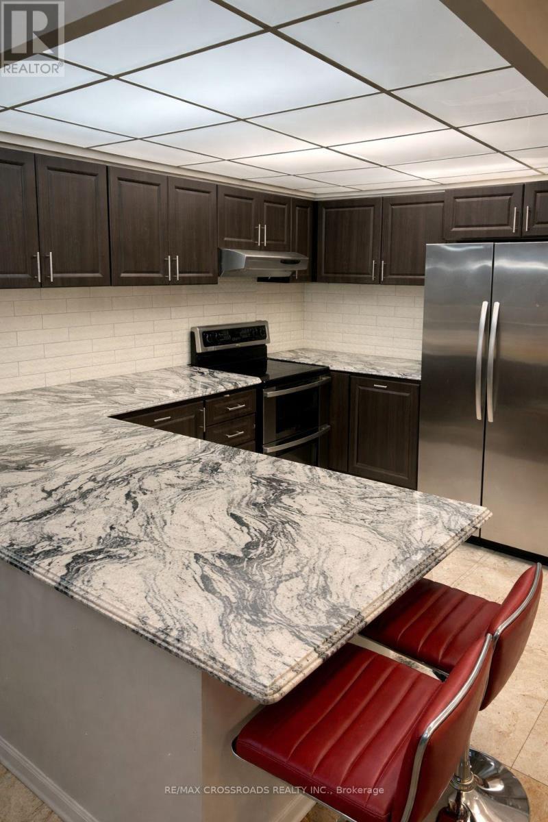 209 - 8 Silverbelle Grove, Toronto, ON - Indoor Photo Showing Kitchen With Upgraded Kitchen