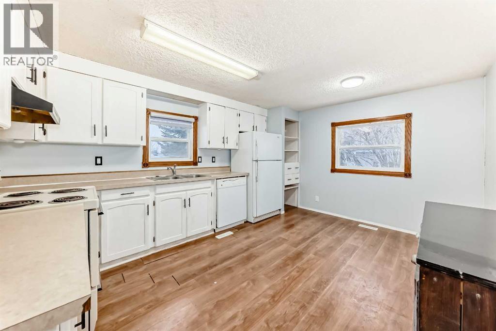 5209 46 Street, Rimbey, AB - Indoor Photo Showing Kitchen With Double Sink