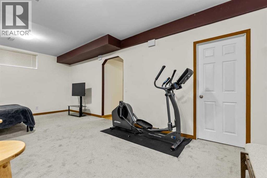 176 Cougar Ridge Circle Sw, Calgary, AB - Indoor Photo Showing Gym Room