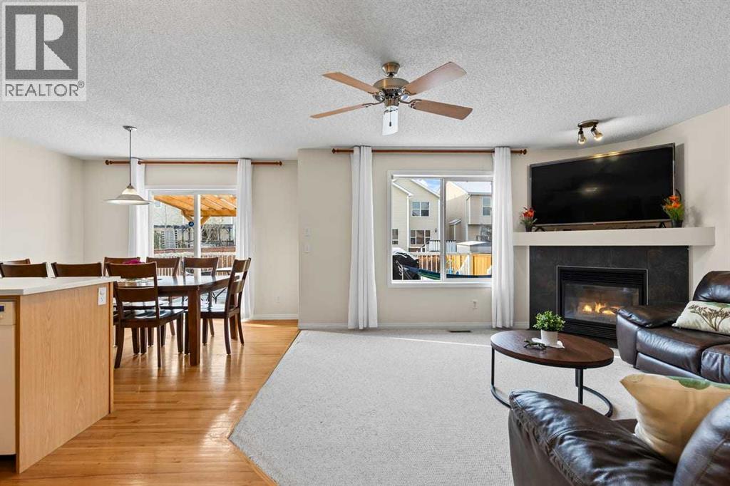 176 Cougar Ridge Circle Sw, Calgary, AB - Indoor Photo Showing Living Room With Fireplace
