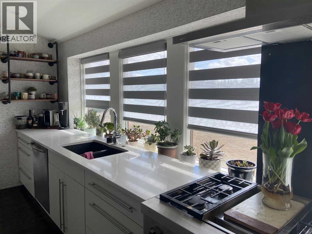 31 Williams Place, Bragg Creek, AB - Indoor Photo Showing Kitchen With Double Sink