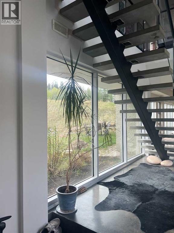 Stairs to upper level - 31 Williams Place, Bragg Creek, AB - Indoor Photo Showing Other Room