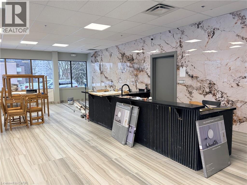 Kitchen with a paneled ceiling, dark cabinetry, and dark countertops - 354 King Street N Unit# 3, Waterloo, ON