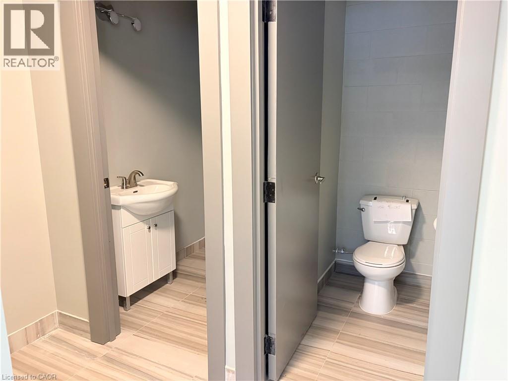 Bathroom featuring vanity and tile walls - 354 King Street N Unit# 3, Waterloo, ON