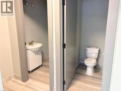 Bathroom featuring vanity and tile walls -