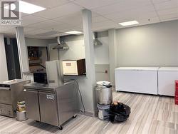 Laundry area featuring a paneled ceiling -