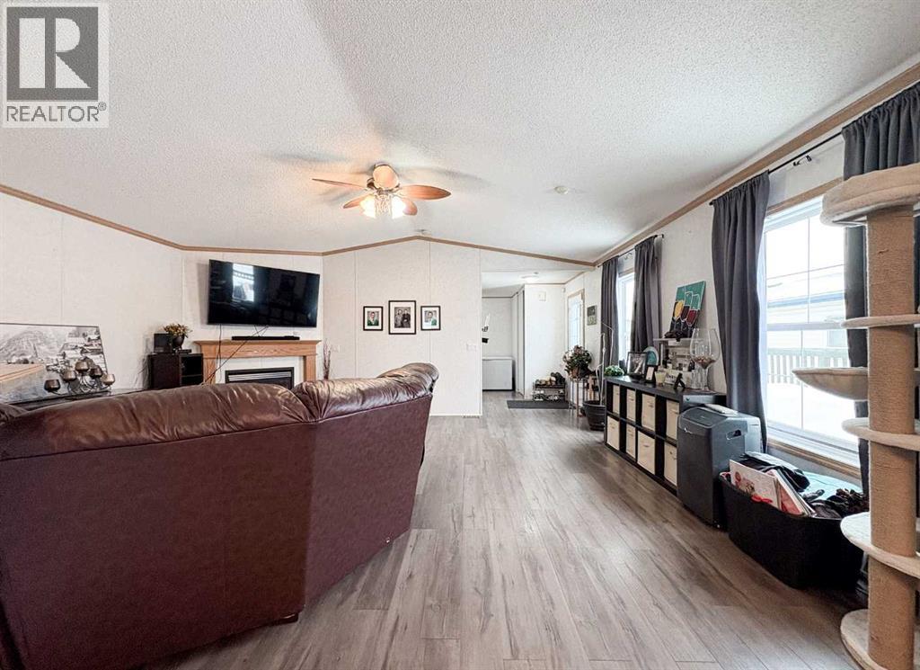 9009 90 Avenue, Grande Prairie, AB - Indoor Photo Showing Living Room With Fireplace