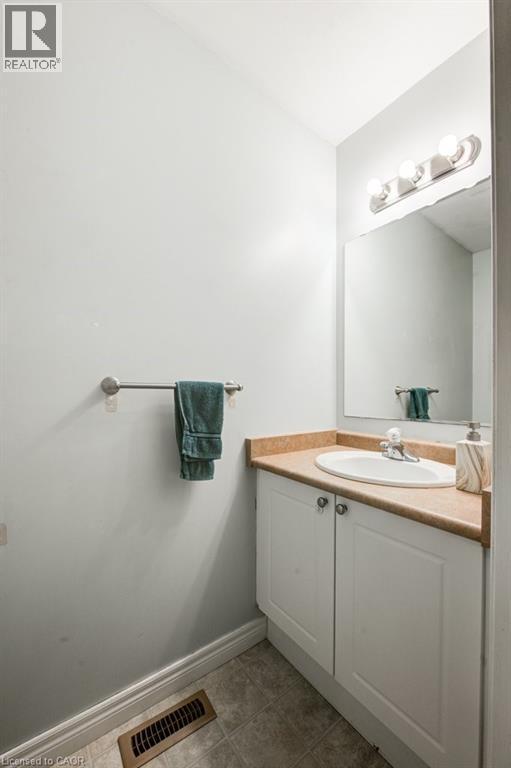 Bathroom featuring vanity and light tile patterned floors - 711 Southwood Way, Woodstock, ON - Indoor Photo Showing Bathroom