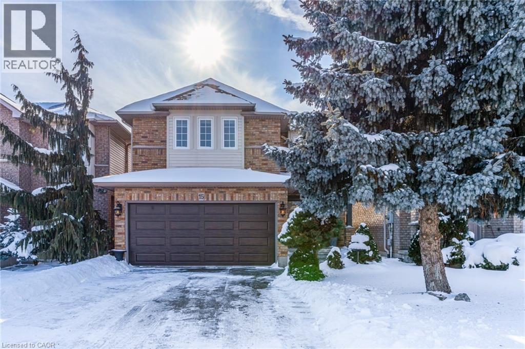 Traditional home featuring an attached garage and brick siding - 15 Claudette Gate, Hamilton, ON - Outdoor