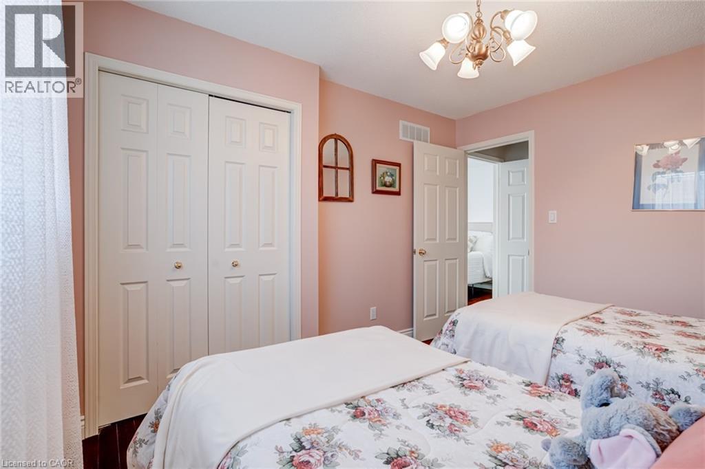 Bedroom with a chandelier and a closet - 15 Claudette Gate, Hamilton, ON - Indoor Photo Showing Bedroom