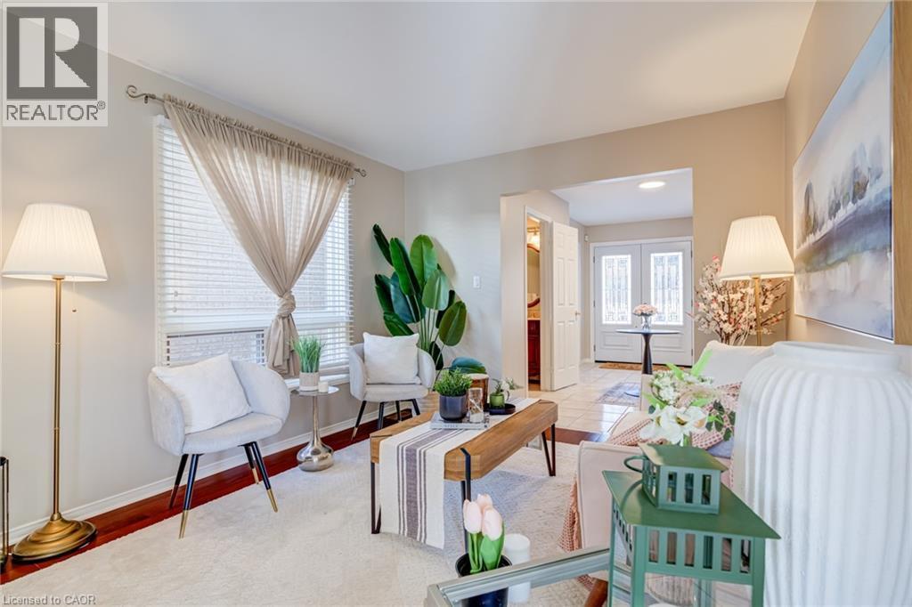 Living room featuring baseboards and french doors - 15 Claudette Gate, Hamilton, ON - Indoor