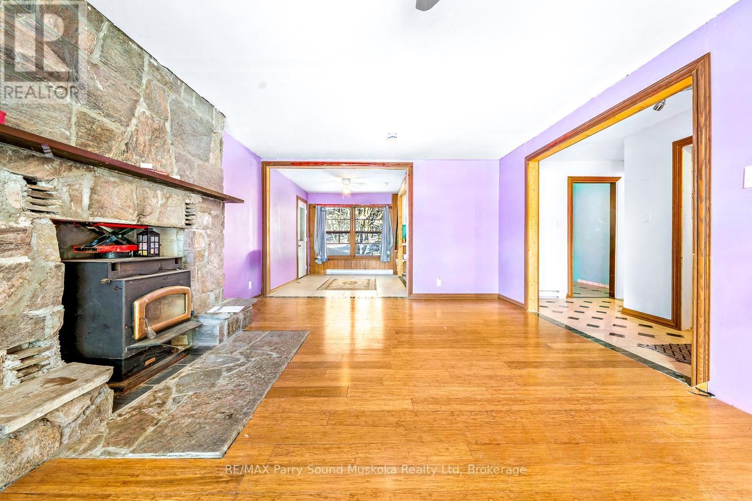 1 Old Carling Road, Carling, ON - Indoor Photo Showing Other Room With Fireplace