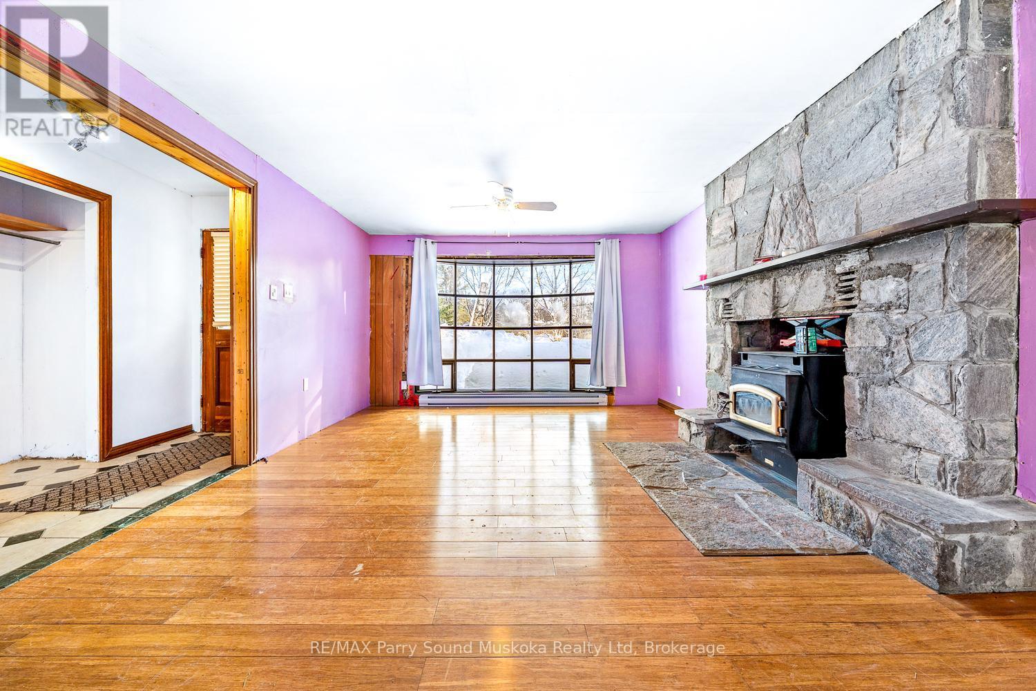 1 Old Carling Road, Carling, ON - Indoor Photo Showing Other Room With Fireplace