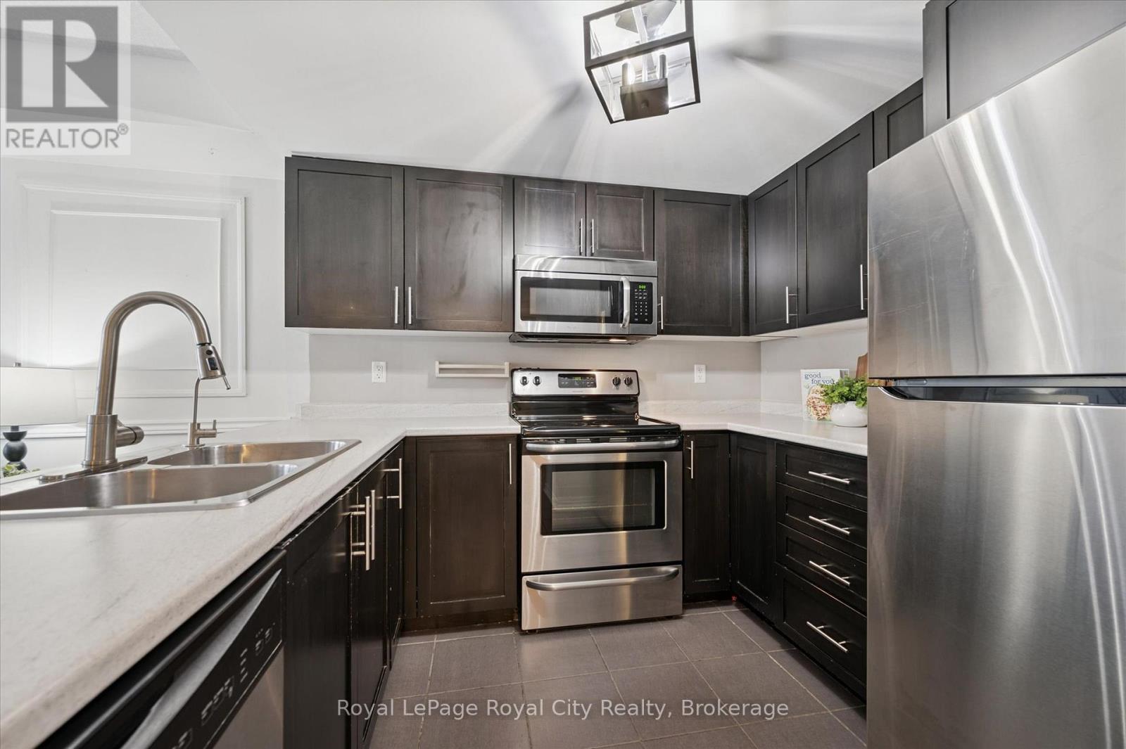 212 - 103 Westminster Crescent, Centre Wellington (Fergus), ON - Indoor Photo Showing Kitchen With Stainless Steel Kitchen With Double Sink With Upgraded Kitchen