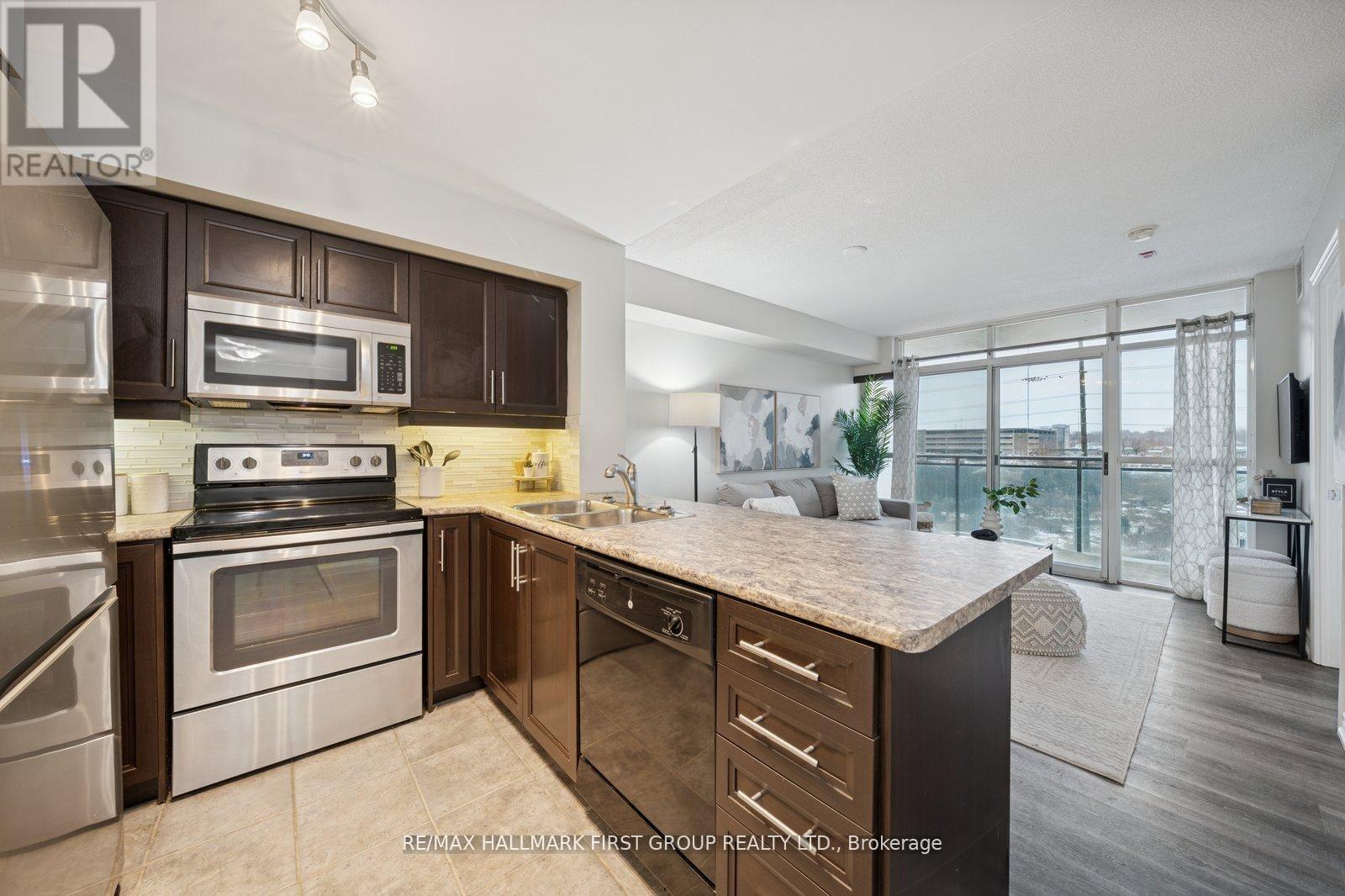 406 - 1600 Charles Street, Whitby, ON - Indoor Photo Showing Kitchen With Double Sink