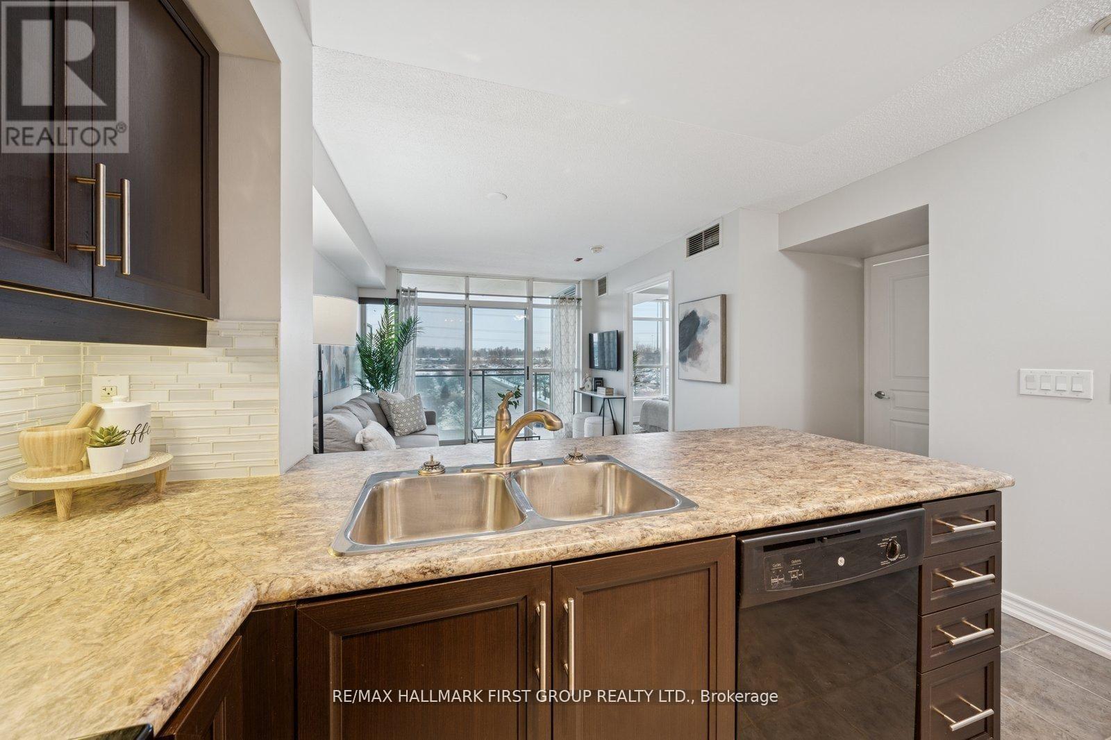 406 - 1600 Charles Street, Whitby, ON - Indoor Photo Showing Kitchen With Double Sink