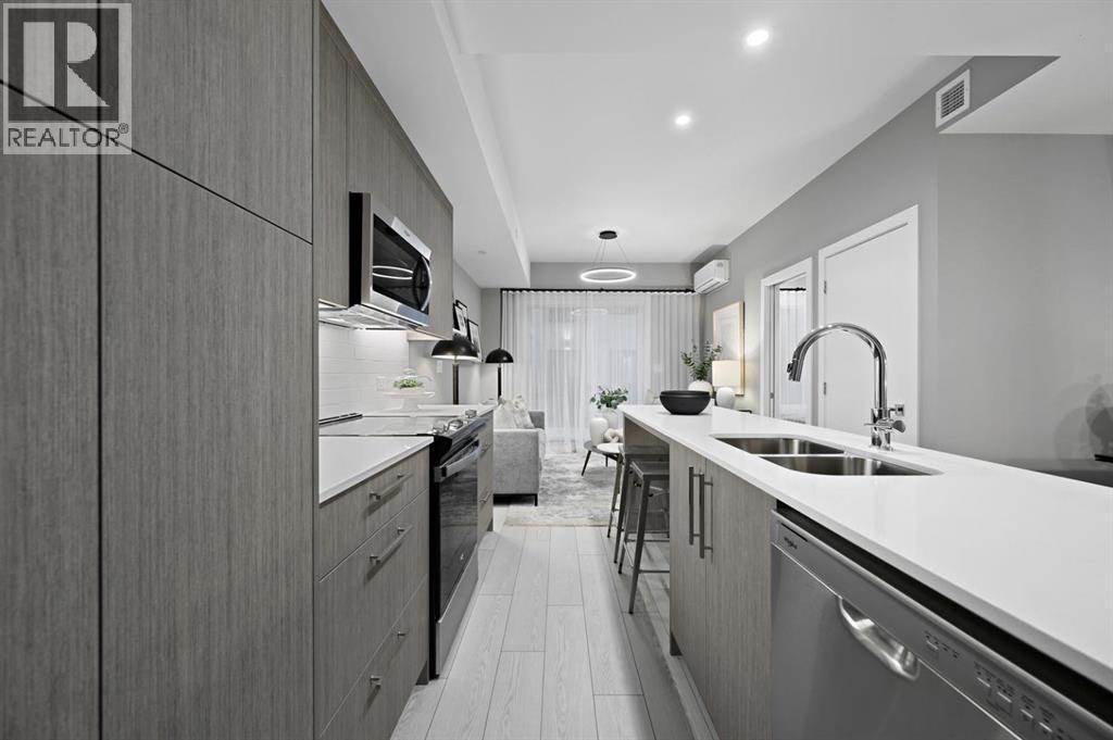 213, 310 15 Avenue Sw, Calgary, AB - Indoor Photo Showing Kitchen With Double Sink