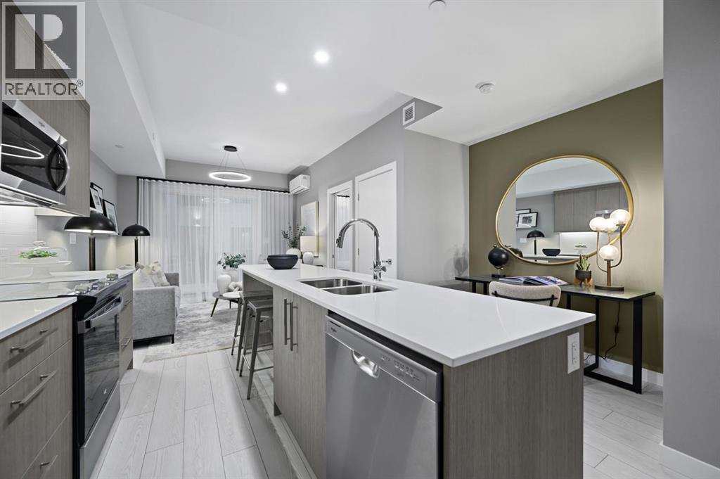 213, 310 15 Avenue Sw, Calgary, AB - Indoor Photo Showing Kitchen With Double Sink