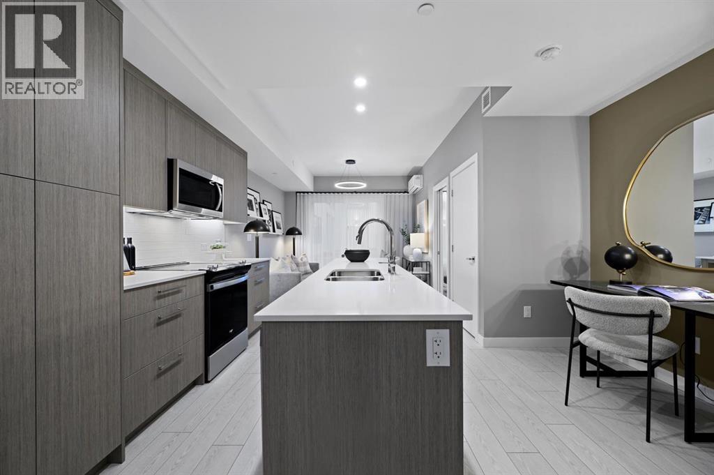 213, 310 15 Avenue Sw, Calgary, AB - Indoor Photo Showing Kitchen With Double Sink