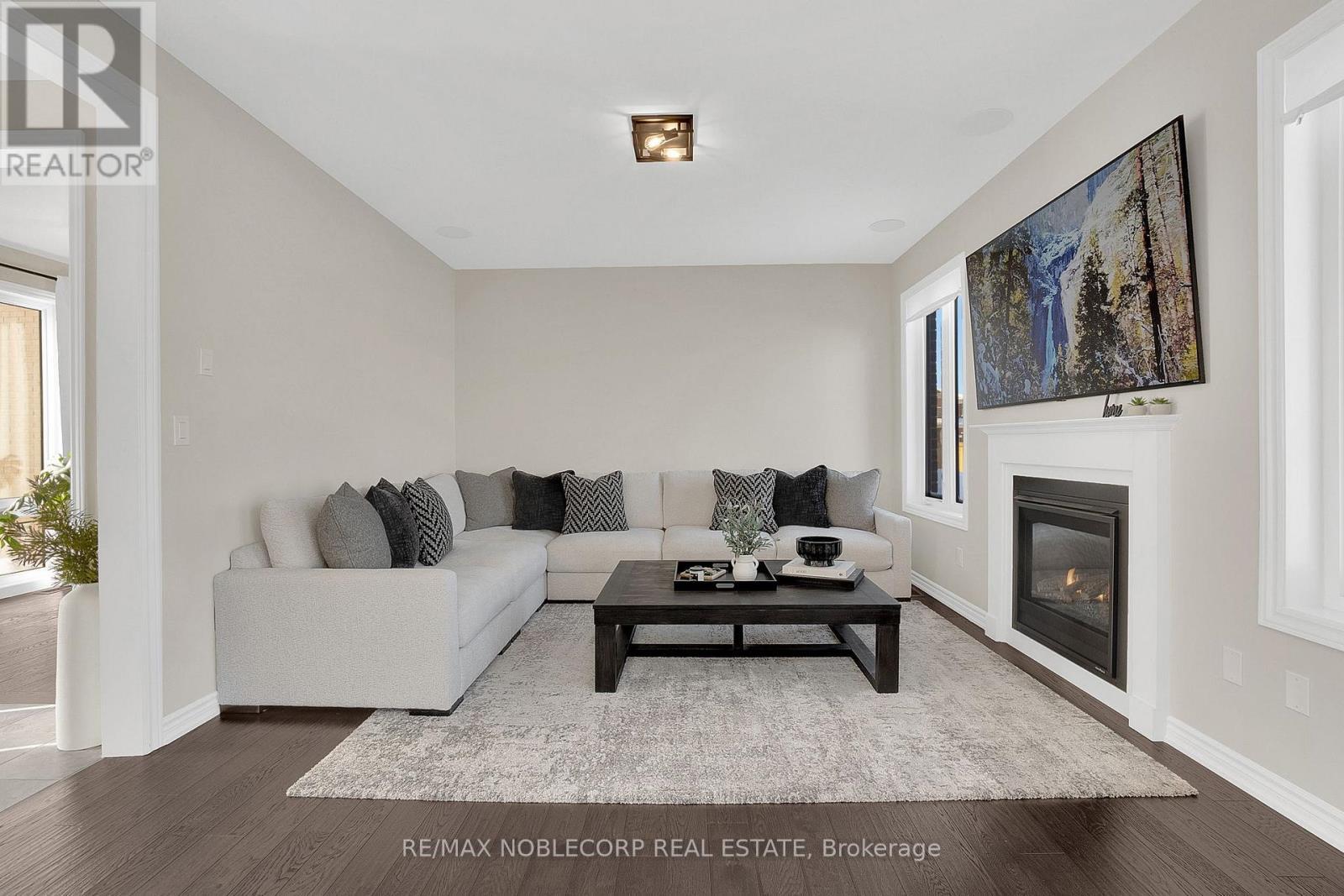 36 Felhazi Trail, Essa, ON - Indoor Photo Showing Living Room With Fireplace
