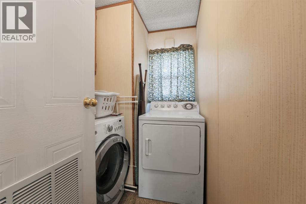 #47, 33009 Range Road 55, Rural Mountain View County, AB - Indoor Photo Showing Laundry Room