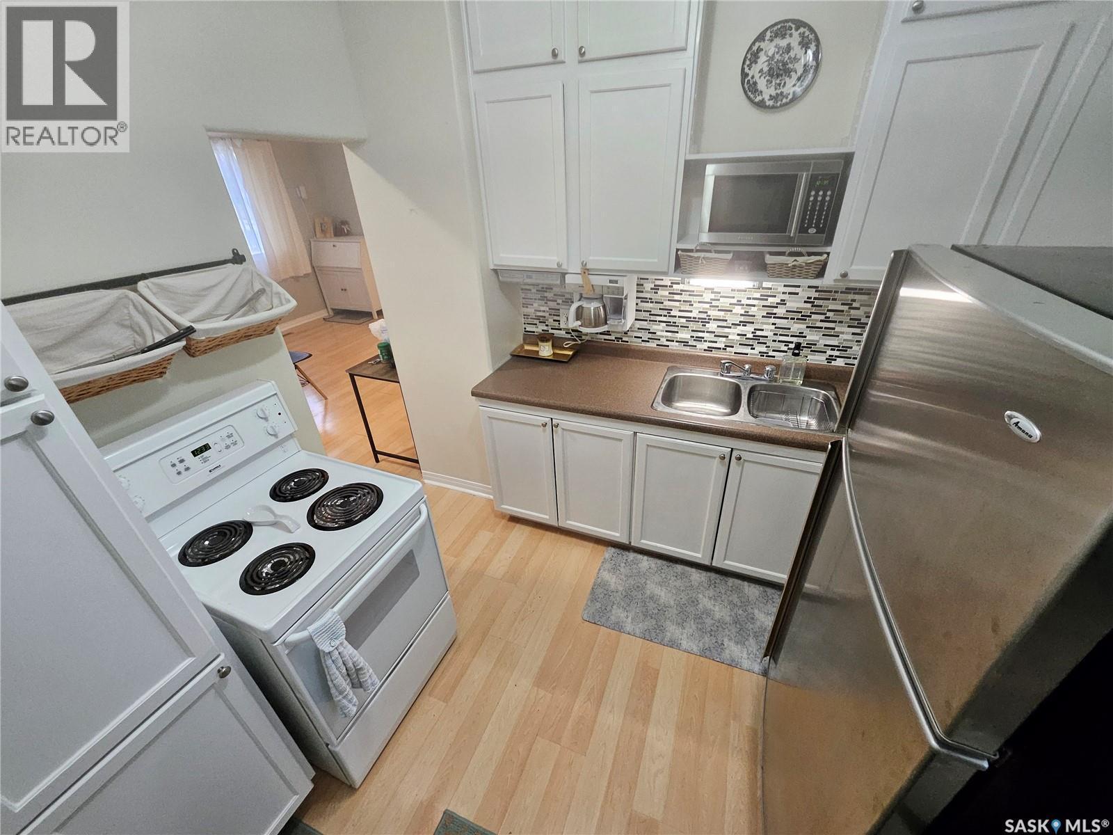 205 Main Street, Midale, SK - Indoor Photo Showing Kitchen With Double Sink
