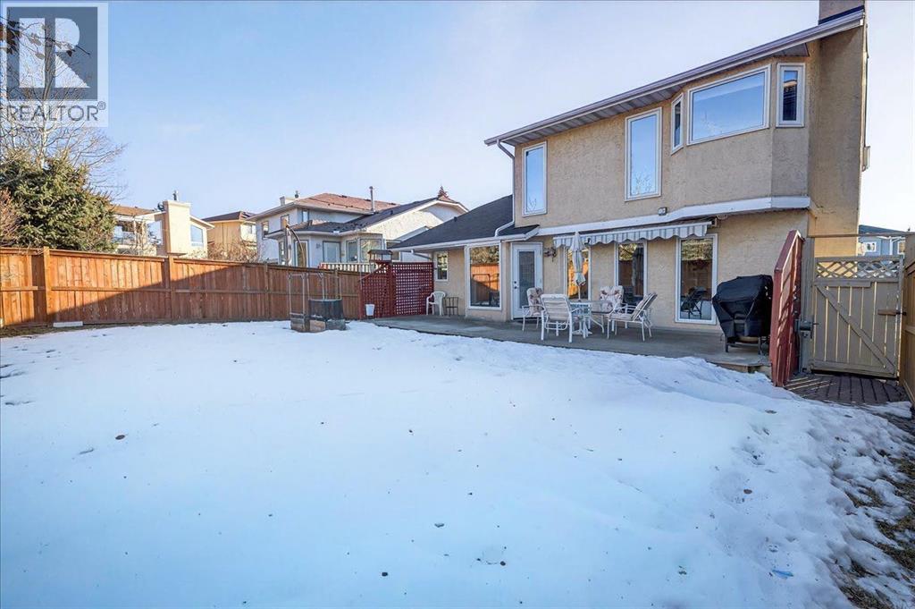 backyard - 137 Woodbrook Road Sw, Calgary, AB - Outdoor With Deck Patio Veranda