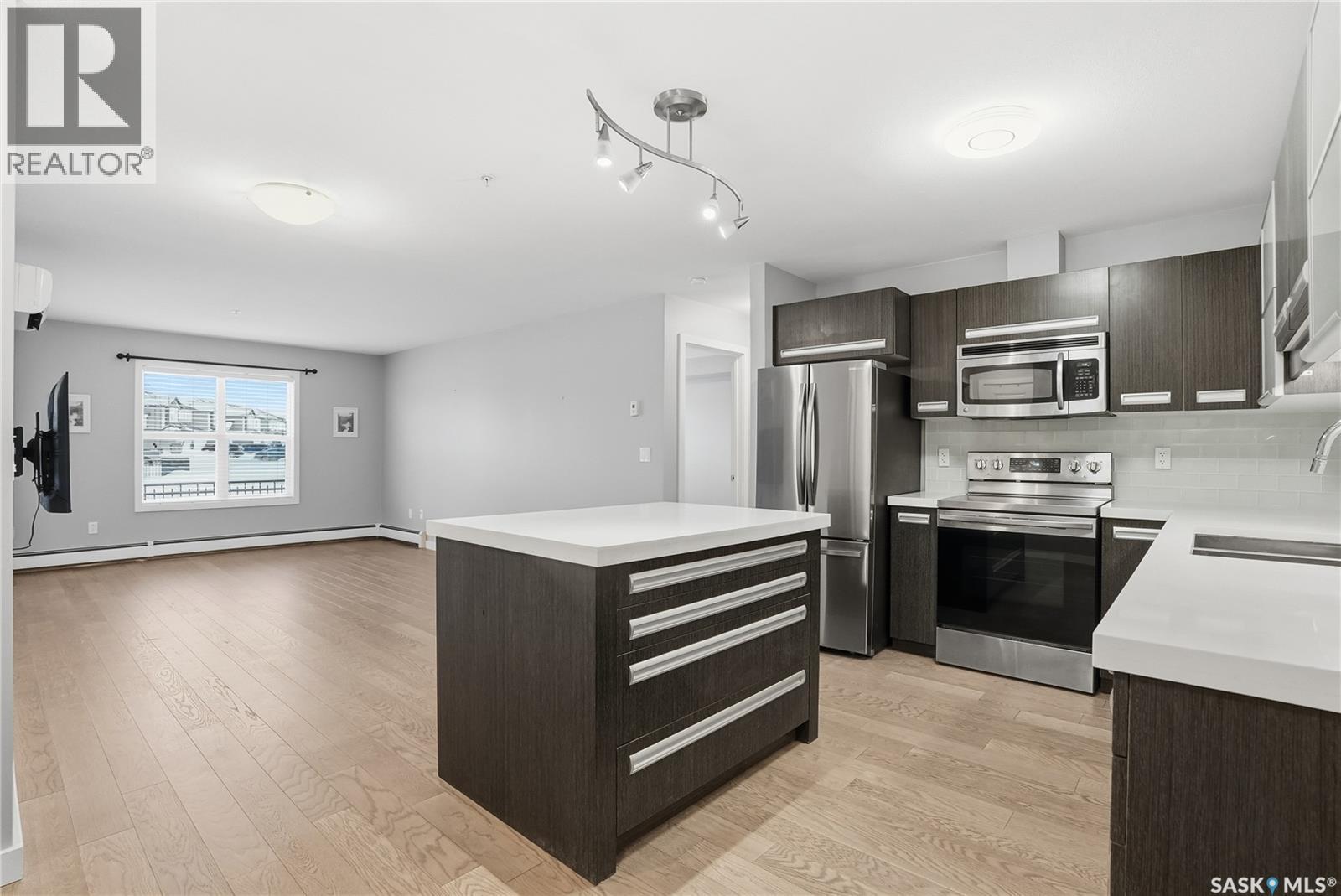 106 211 Ledingham Street, Saskatoon, SK - Indoor Photo Showing Kitchen With Stainless Steel Kitchen
