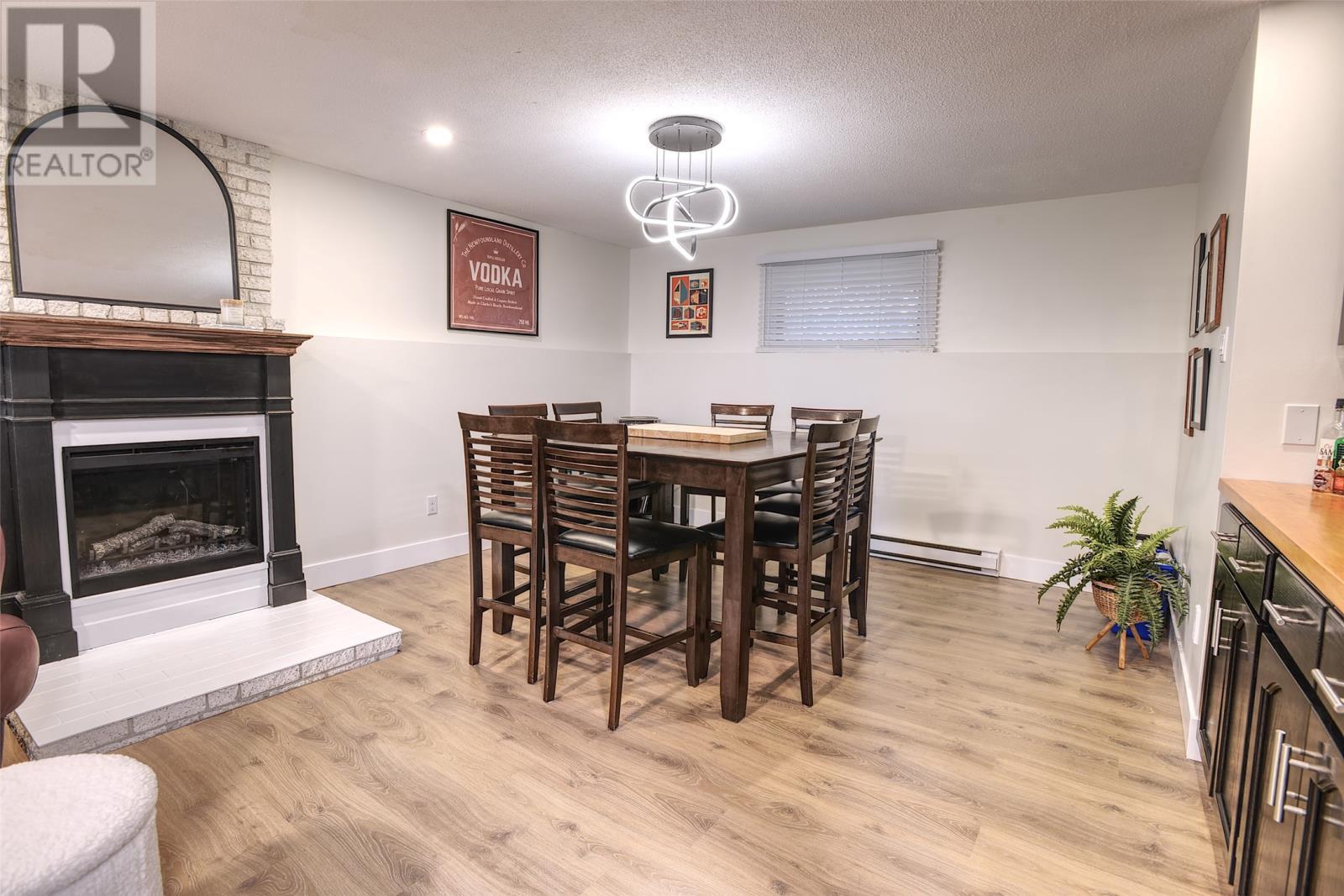 20 Mercers Road, Conception Bay South, NL - Indoor Photo Showing Other Room With Fireplace