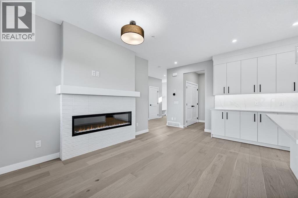 150 Prince Crescent, Rural Rocky View County, AB - Indoor Photo Showing Other Room With Fireplace
