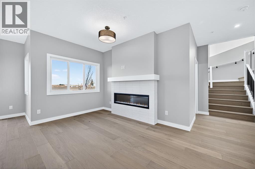 150 Prince Crescent, Rural Rocky View County, AB - Indoor Photo Showing Living Room With Fireplace