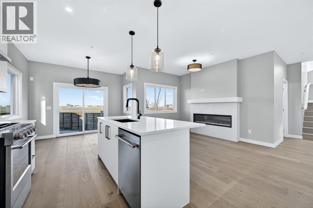 150 Prince Crescent, Rural Rocky View County, AB - Indoor Photo Showing Kitchen With Fireplace With Stainless Steel Kitchen With Upgraded Kitchen