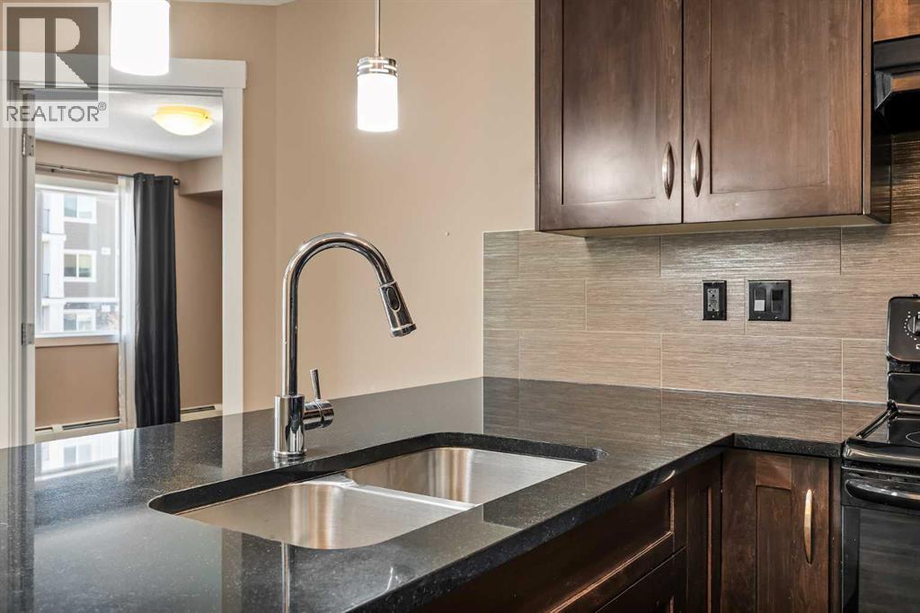 2209, 450 Sage Valley Drive Nw, Calgary, AB - Indoor Photo Showing Kitchen With Double Sink