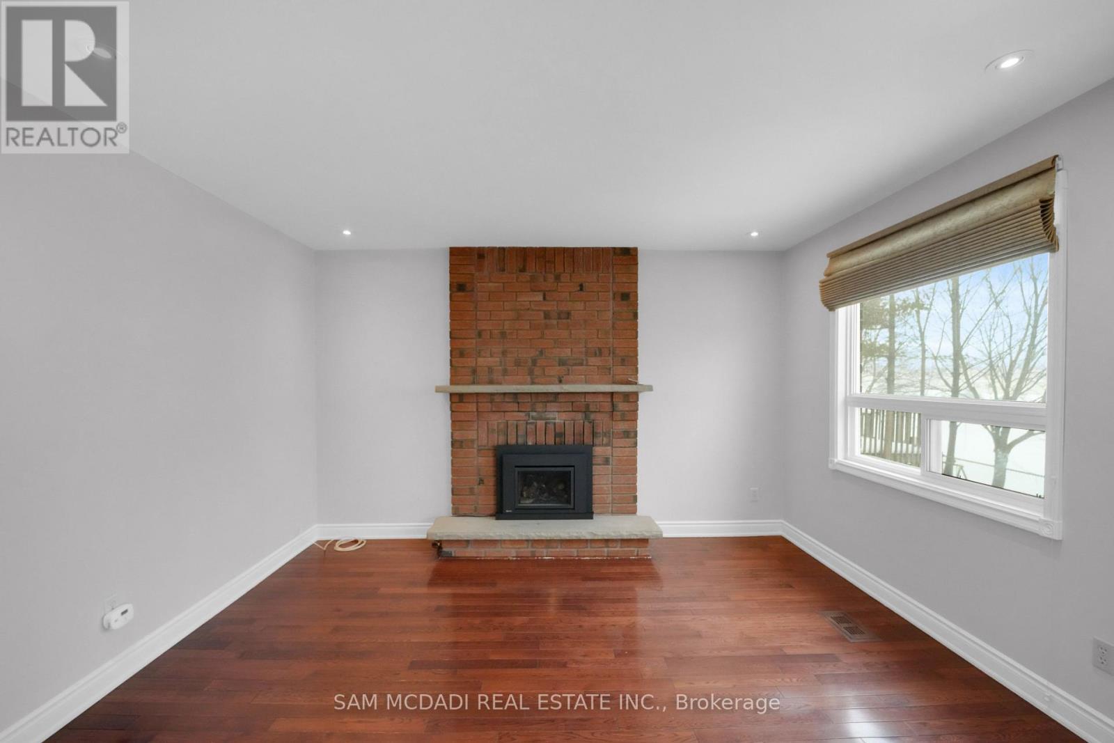 Family room - 5275 Thornwood Drive, Mississauga, ON - Indoor With Fireplace