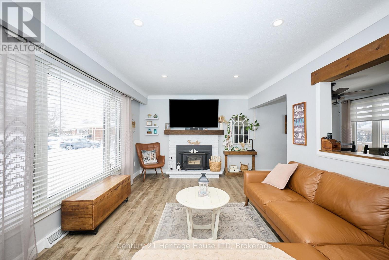 Living room with wood stove - 8845 Banting Avenue, Niagara Falls (Chippawa), ON - Indoor Photo Showing Living Room With Fireplace