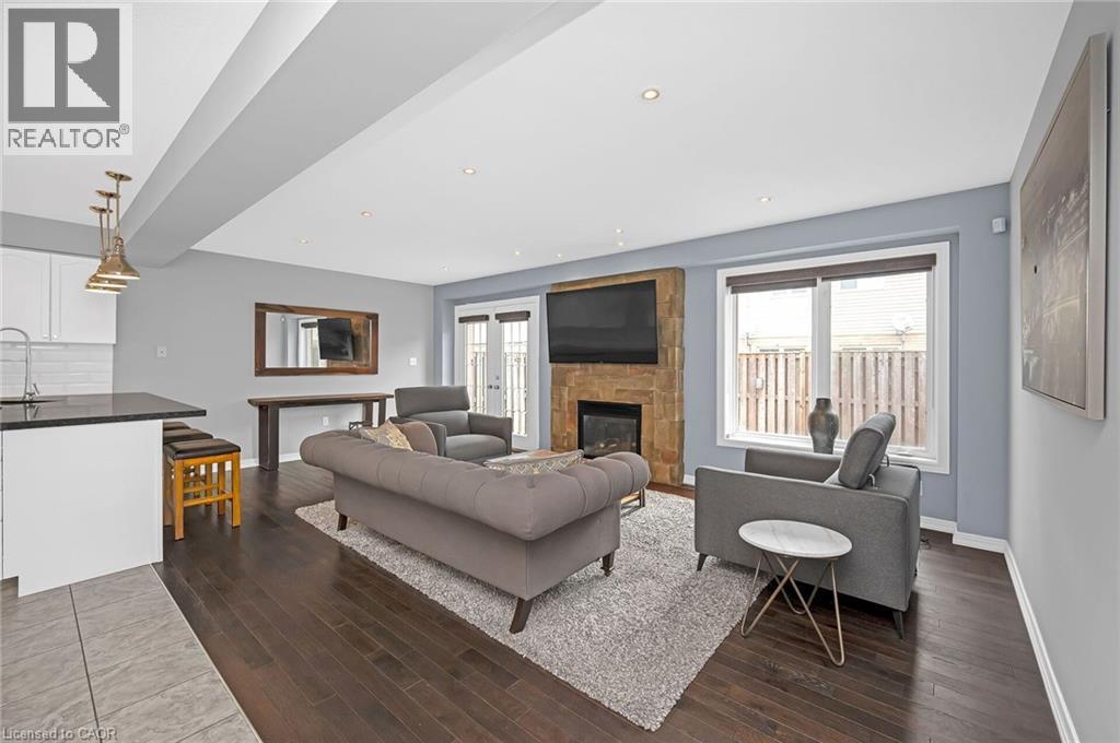 23 Bellflower Boulevard, Hamilton, ON - Indoor Photo Showing Living Room With Fireplace