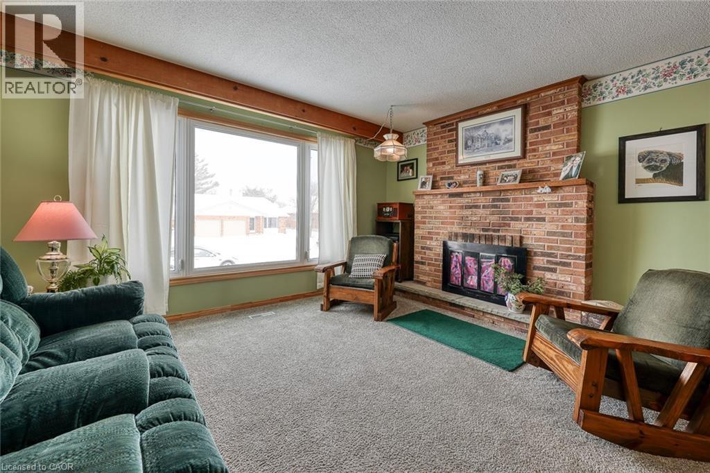 249 Macdonald Drive, Woodstock, ON - Indoor Photo Showing Living Room With Fireplace