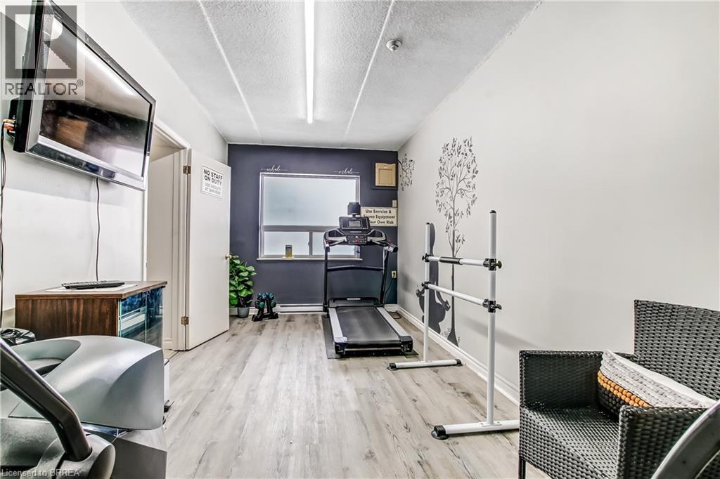 Building's exercise room. - 88 Tollgate Road Unit# 402, Brantford, ON - Indoor