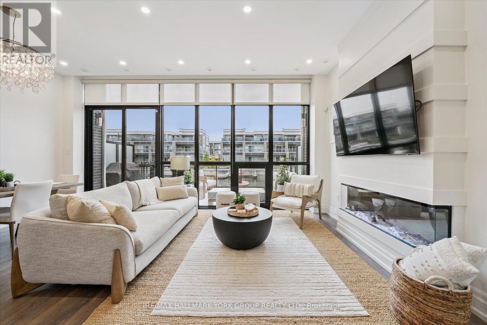 3753 Riva Avenue, Innisfil, ON - Indoor Photo Showing Living Room With Fireplace