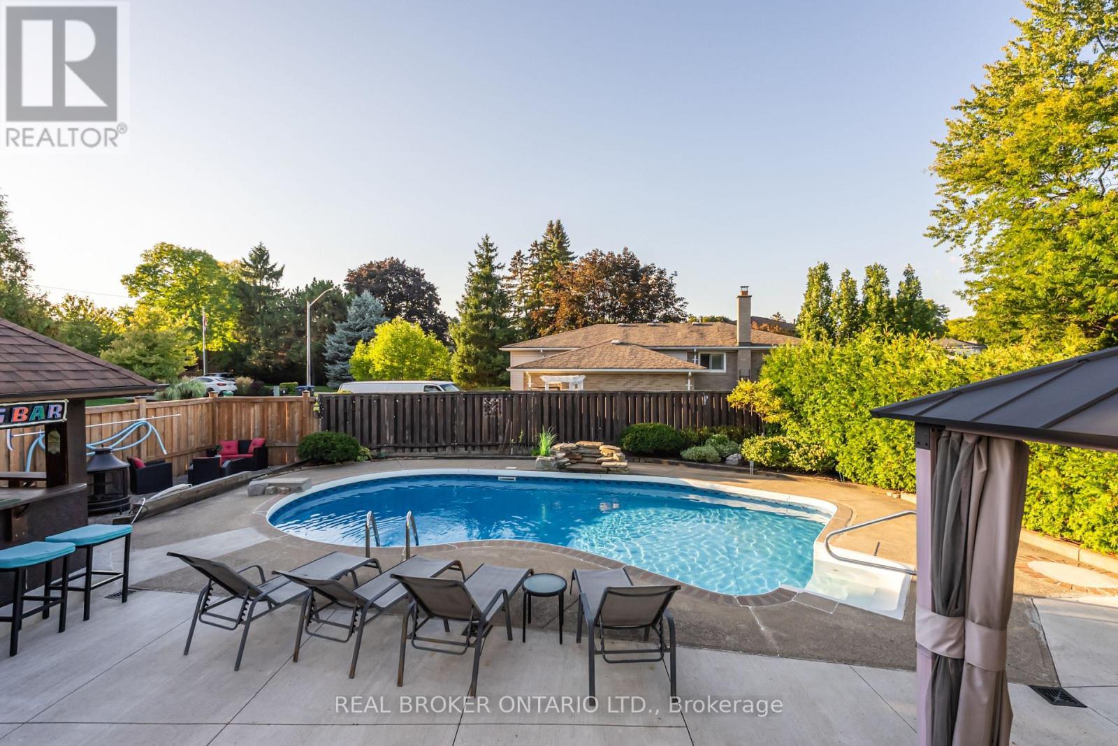 4 Pool Loungers Included - 13 Pine Tree Crescent, Brampton, ON - Outdoor With In Ground Pool