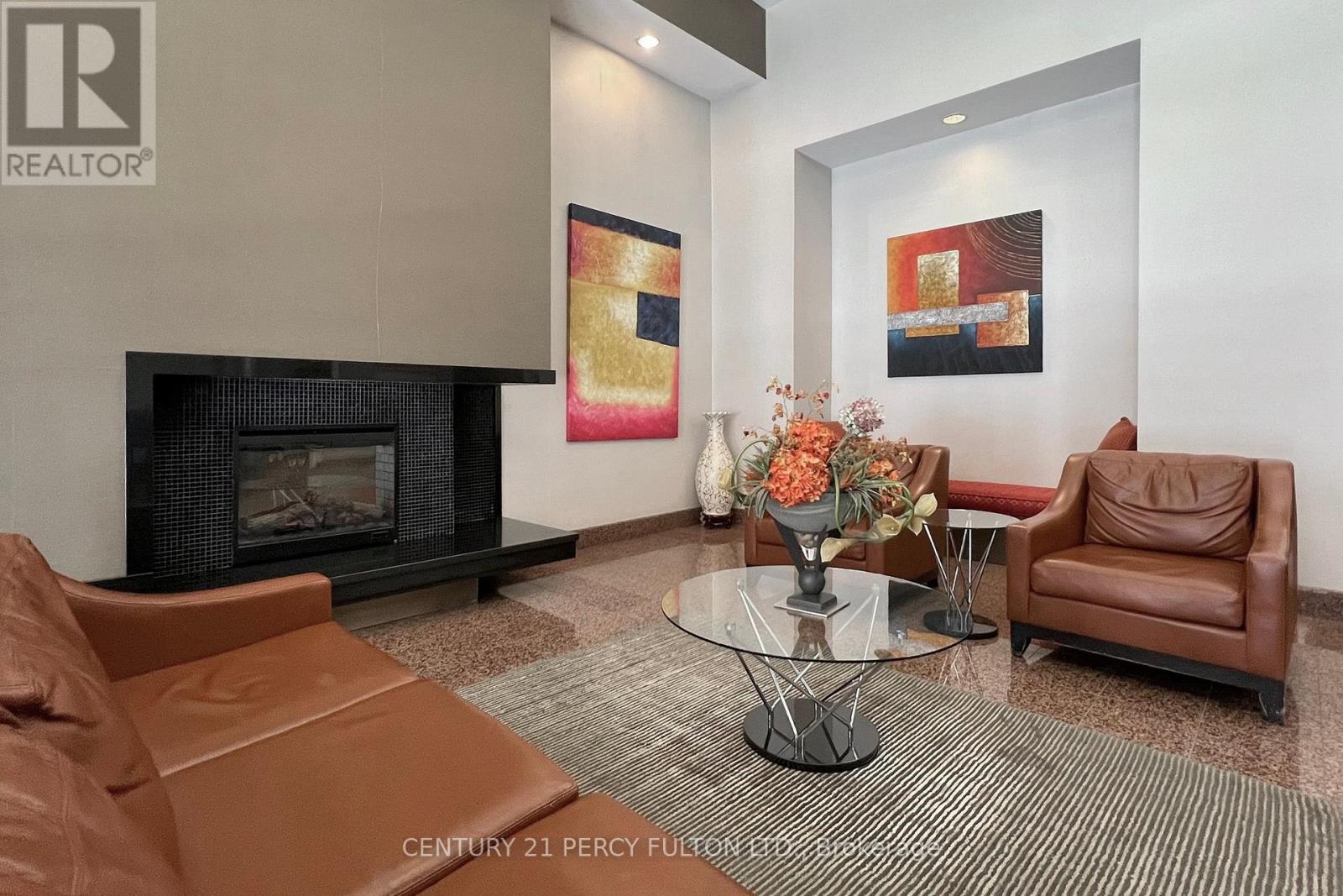 703 - 736 Bay Street, Toronto, ON - Indoor Photo Showing Living Room With Fireplace